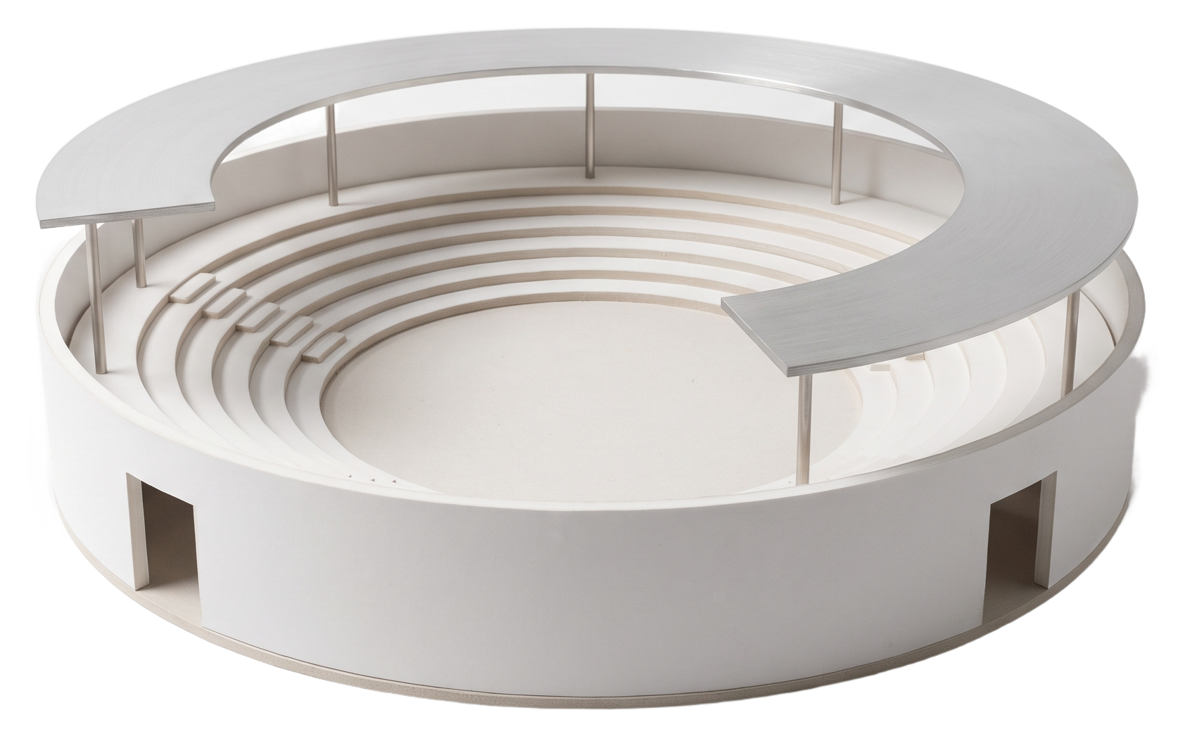 White architectural model of an open forum pavilion. A thin roof on slender columns over an open central space, empty and waiting to be occupied.